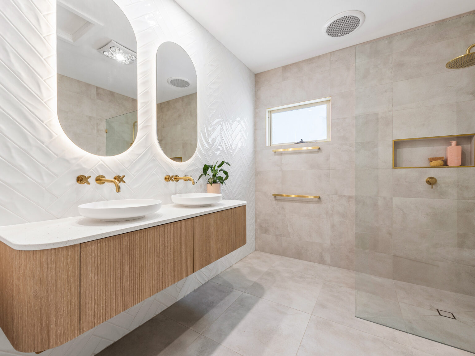 Brass rainfall shower and niche in tiled shower wall with integrated fittings