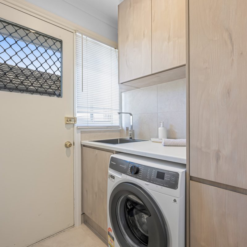 Close-up of vanity basin and chrome mixer tapware