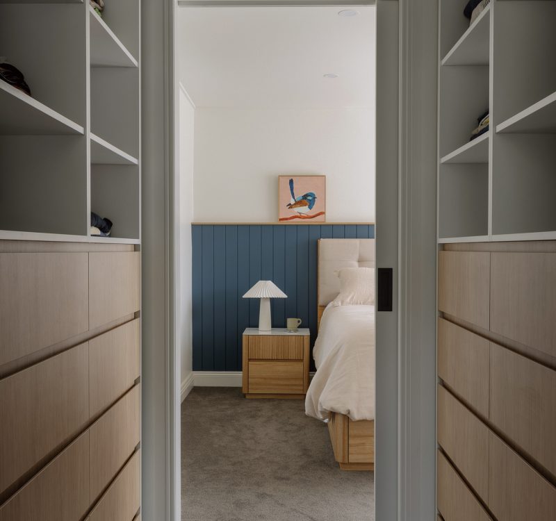 High-end custom vanity with modern basin design and frameless mirror in a contemporary ensuite.
